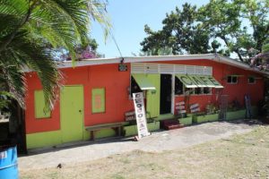 The colorful wooden facade of the Shore Things Cafe